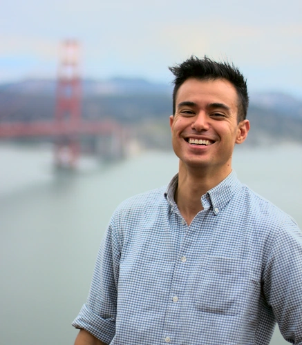 Josh Moller-Mara smiling with the Golden Gate Bridge in the background